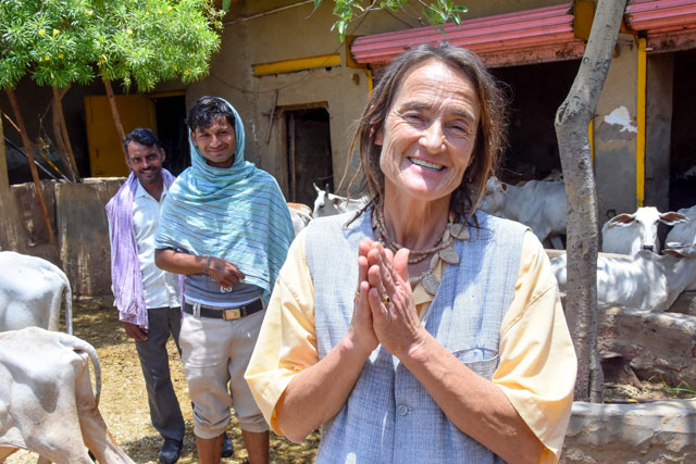 german citizen friederike irina bruning 61 also known as sudevi mataji gestures as indian workers look on at the cowshed at radhakund village in mathura district of uttar pradesh state on may 27 2019 photo afp