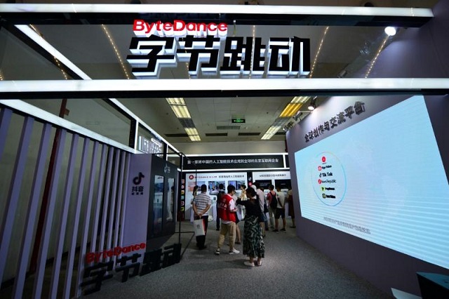 visitors are seen at the booth of bytedance technology which owns news aggregator app jinri toutiao and short video app tik tok or douyin at the china international software expo in beijing china june 29 2018 photo reuters