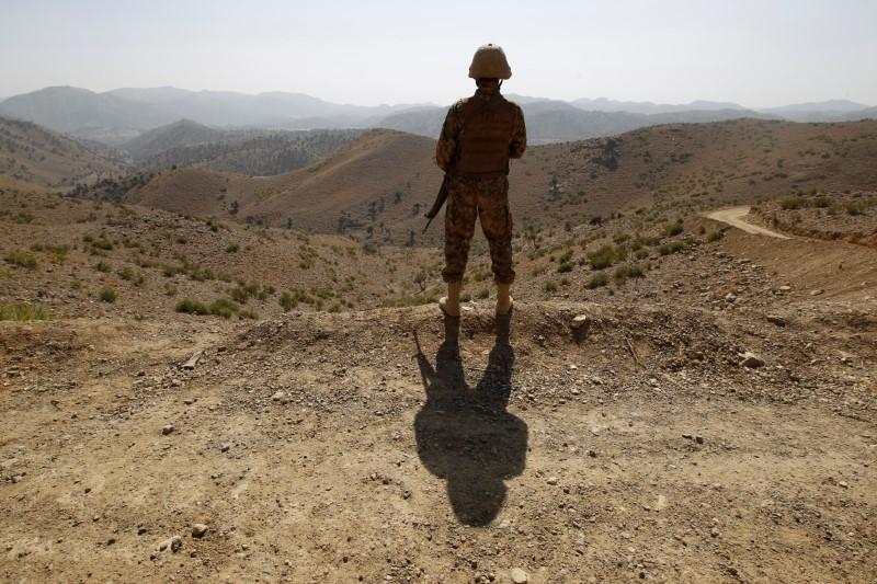 a soldier stands guard outside the kitton outpost along the border fence on the border with afghanistan in north waziristan pakistan october 18 2017 photo reuters