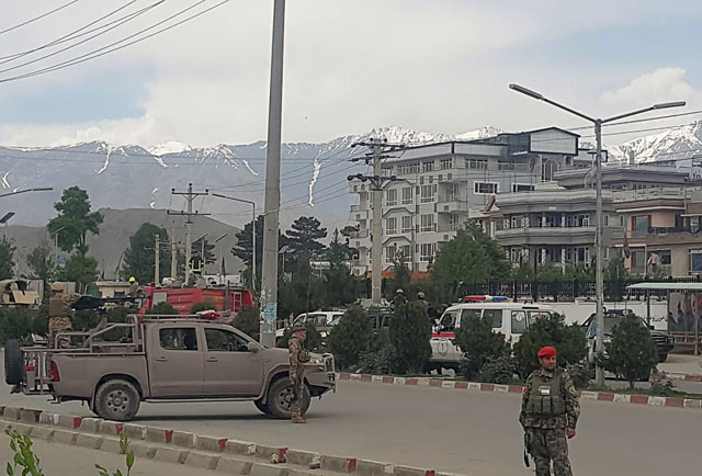 afghan security personnel arrive near a site of an attack near the marshal fahim military academy base in kabul on may 30 2019 photo afp