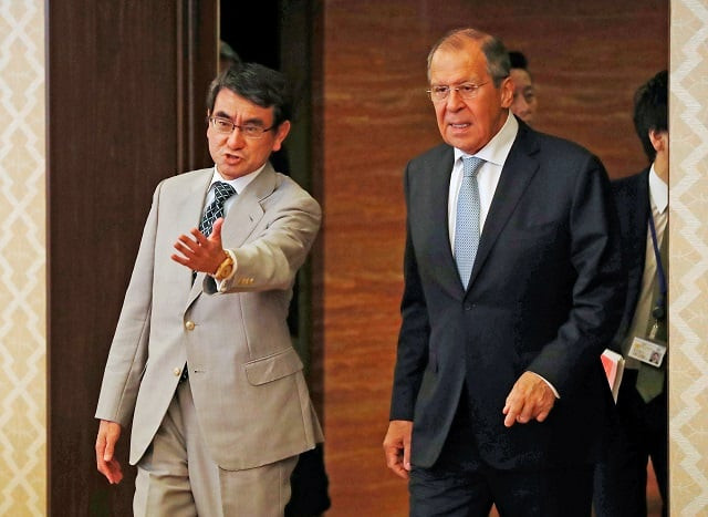 russian foreign minister sergei lavrov is escorted by japanese foreign minister taro kono upon arrival for their talks at the iikura guest house in tokyo japan photo reuters