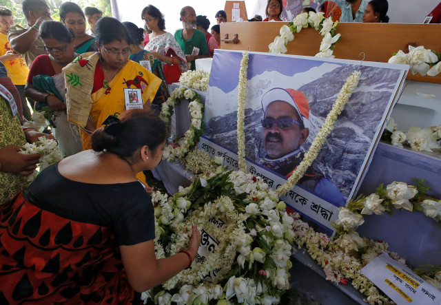 people pay homage in front of a portrait of dipankar ghosh a 52 year old indian photographer who scaled the world 039 s fifth highest peak the snow capped mount makalu before his funeral in howrah district in the eastern state of west bengal india may 29 2019 reuters people pay homage in front of a portrait of dipankar ghosh a 52 year old indian photographer who scaled the world 039 s fifth highest peak the snow capped mount makalu before his funeral in howrah district in the eastern state of west bengal india may 29 2019 reuters