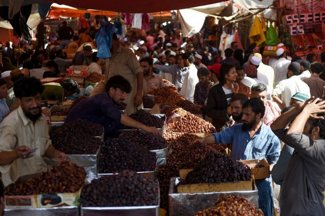 muslims buy dates at a market in preparation for the muslim fasting month of ramadan in karachi pakistan photo afp muslims buy dates at a market in preparation for the muslim fasting month of ramadan in karachi pakistan photo afp