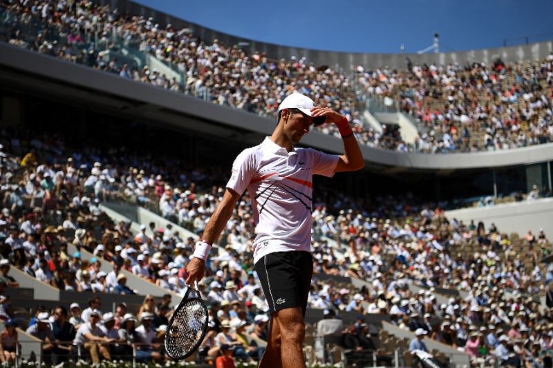 world number one bidding to become just the second man to hold all four slams at the same time twice photo afp