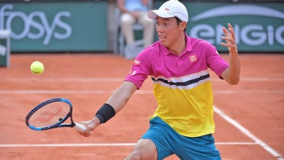 french open nishikori beats paire to set up nadal clash