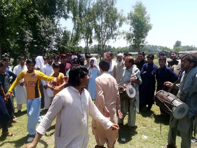 children enjoy donkey back ride in peshawar while youngsters perform the traditional pushtun dance photos express