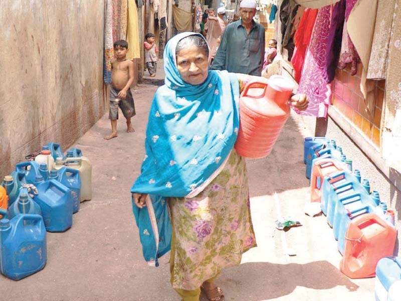 an elderly woman takes empty gallons to collect water residents in numerous areas remained deprived of water during eid and were forced to buy water at higher prices from private tanker owners photo file