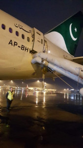 passenger mistakes exit door for toilet on pia flight