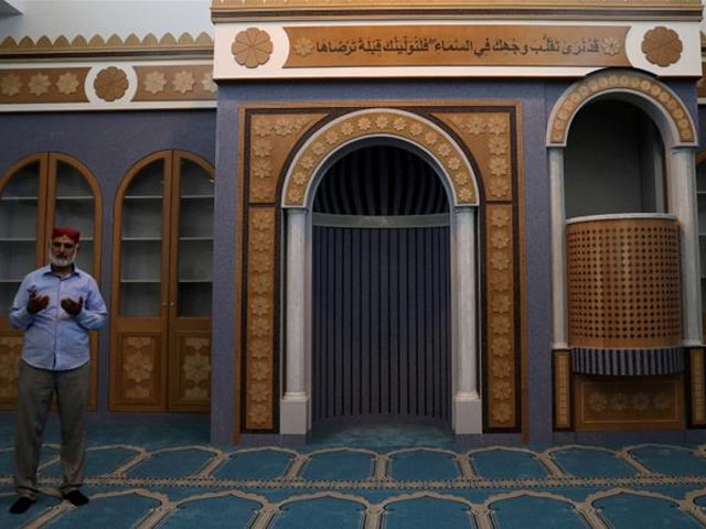 a muslim man prays inside the first official mosque in athens photo reuters