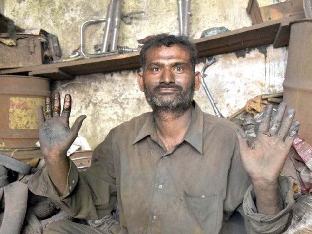 the nature of his job has made the hands of the auto mechanic very rough photo express the nature of his job has made the hands of the auto mechanic very rough photo express