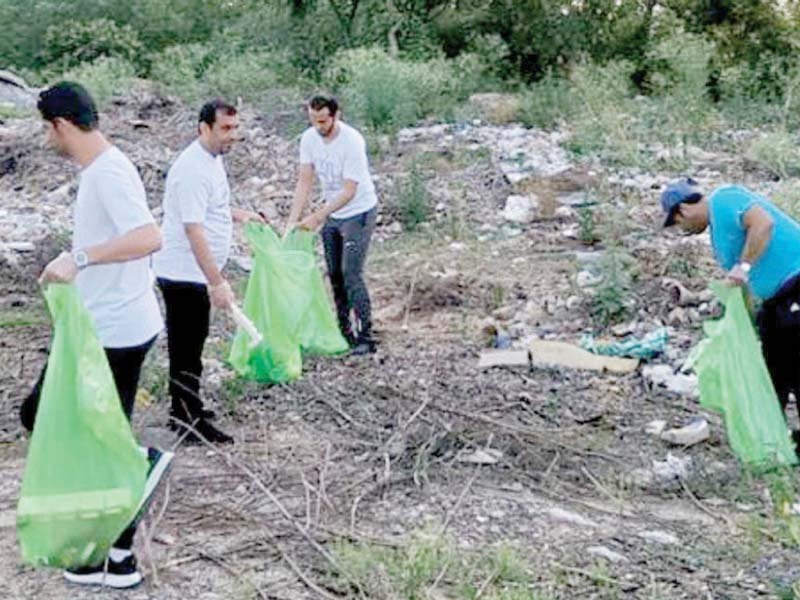 staff of uae embassy seen clearing rubbish in the diplomatic enclave photo dna