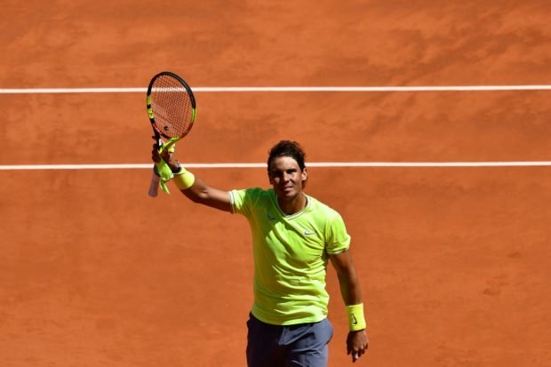 spain 039 s rafael nadal celebrates after winning against switzerland 039 s roger federer during their men 039 s singles semi final match on day 13 of the roland garros 2019 french open tennis tournament in paris on june 7 2019 photo afp