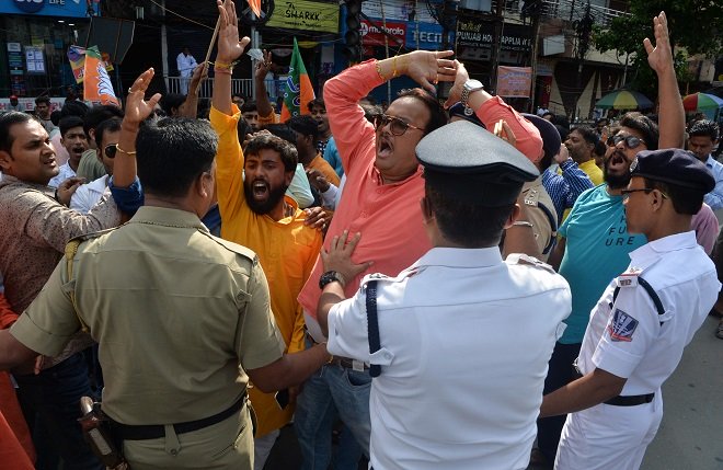 indian supporters of bjp shout slogans as they block road during protest against the recent killings in west bengal photo afp