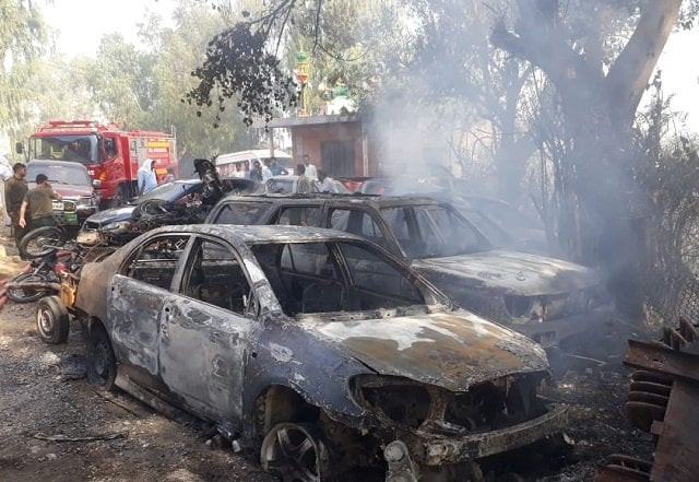 officials claim extreme hot and dry weather causes fire at bushes surrounding police station photo express officials claim extreme hot and dry weather causes fire at bushes surrounding police station photo express