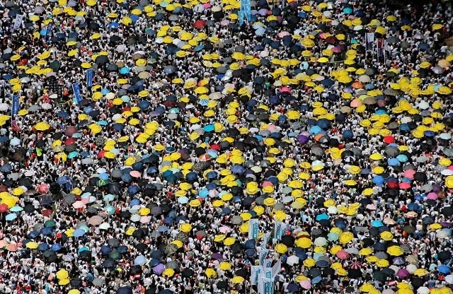 demonstrators hold yellow umbrellas the symbol of the occupy central movement during a protest to demand authorities scrap a proposed extradition bill with china in hong kong china june 9 2019 photo reuters