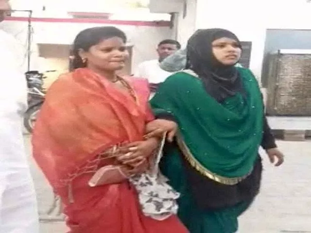 puja chauhan left with a muslim woman photo courtesy the times of india puja chauhan left with a muslim woman photo courtesy the times of india