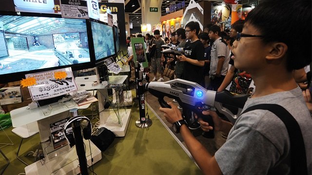 children play the latest video games at the 13th ani com comic book and game gair in hong kong on july 29 2011 photo afp