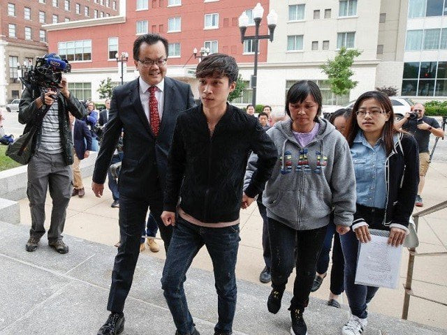 the brother c and mother 2ndr of chinese scholar zhang yingying arrive at a federal court in peoria illinois for the trial of brendt christensen who is suspected of kidnapping and killing zhang in june 2017 photo afp the brother c and mother 2ndr of chinese scholar zhang yingying arrive at a federal court in peoria illinois for the trial of brendt christensen who is suspected of kidnapping and killing zhang in june 2017 photo afp