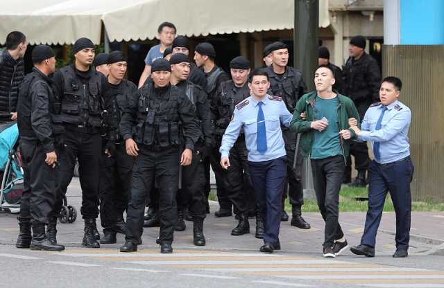 law enforcement officers detain a man during an opposition rally held by critics of kazakh president kassym jomart tokayev who protest over his election in almaty kazakhstan june 12 2019 photo reuters