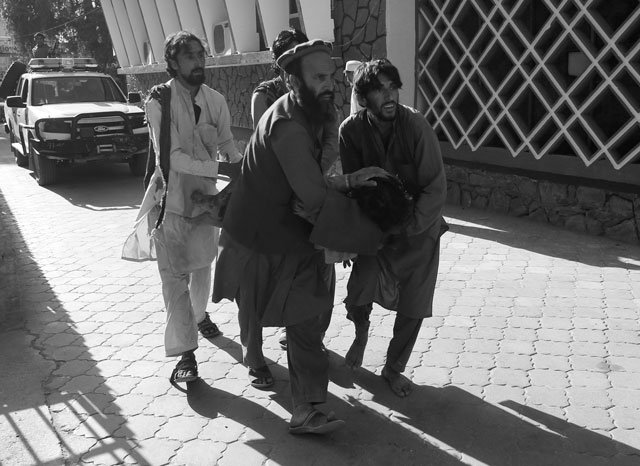 afghan men carry a wounded person to the hospital after a suicide attack in jalalabad afghanistan june 13 2019 photo reuters