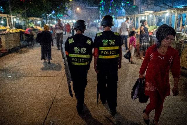 police patrol a night food market near the id kah mosque in kashgar in china 039 s xinjiang uighur autonomous region one day before the eid al fitr holiday photo afp police patrol a night food market near the id kah mosque in kashgar in china 039 s xinjiang uighur autonomous region one day before the eid al fitr holiday photo afp