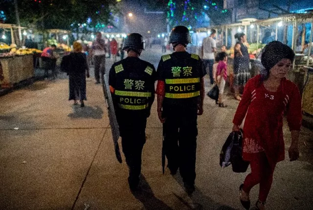 police patrol a night food market near the id kah mosque in kashgar in china 039 s xinjiang uighur autonomous region one day before the eid al fitr holiday photo afp police patrol a night food market near the id kah mosque in kashgar in china 039 s xinjiang uighur autonomous region one day before the eid al fitr holiday photo afp