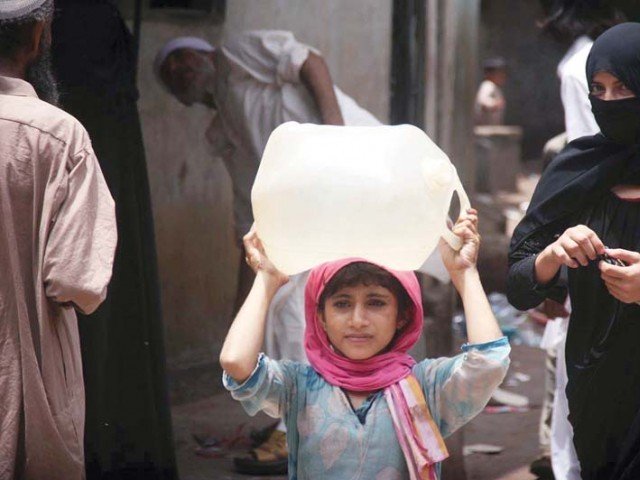 a girl in lyari fetches water for her house as kwsb supply lines run dry photo online file