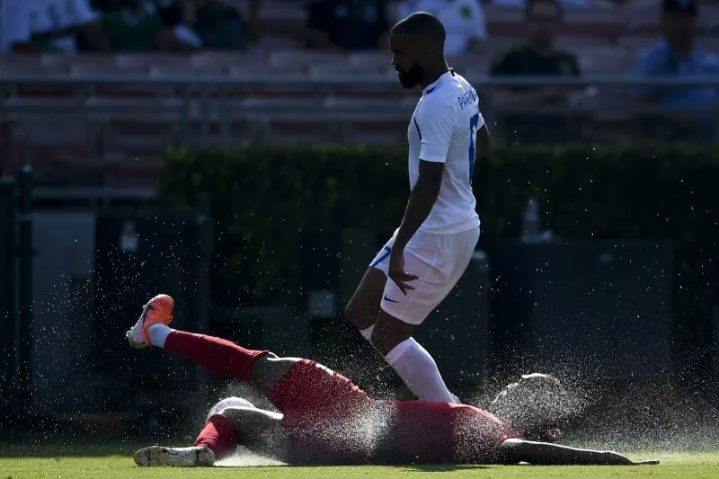 canada defender derek cornelius 4 slides for the ball in front of martinique forward kevin parsemain 17 during the second half of group play in the concacaf gold cup soccer tournament at rose bowl photo reuters canada defender derek cornelius 4 slides for the ball in front of martinique forward kevin parsemain 17 during the second half of group play in the concacaf gold cup soccer tournament at rose bowl photo reuters