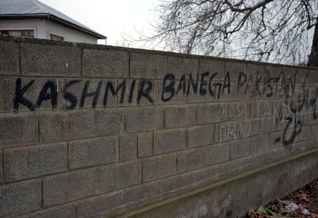 graffiti on a wall reading quot kashmir will become pakistan quot is pictured in pinglan village in occupied kashmir 039 s pulwama district march 23 2019 photo reuters