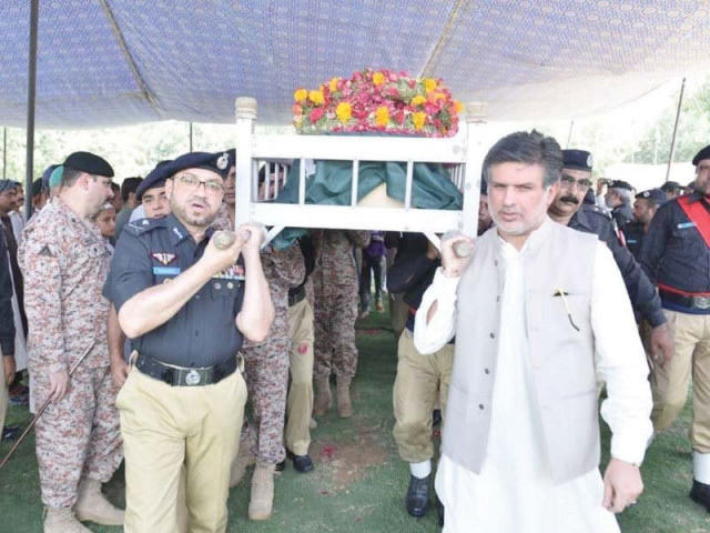 sindh igp dr syed kaleem imam carries the body of one of the two police personnel martyred in a targeted attack on monday morning photo online sindh igp dr syed kaleem imam carries the body of one of the two police personnel martyred in a targeted attack on monday morning photo online