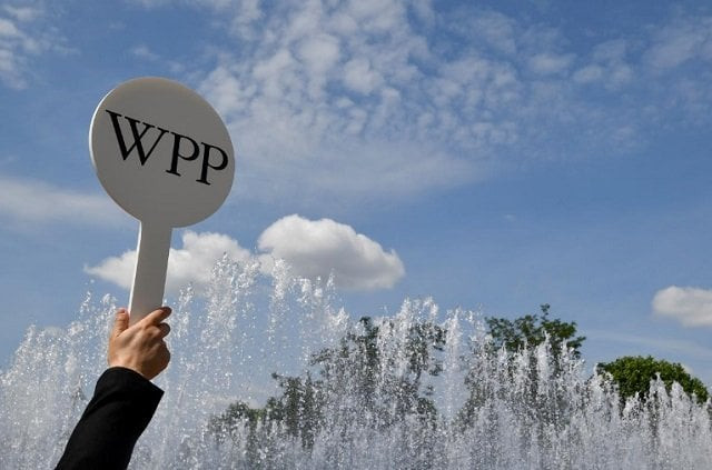 an usher holds a baton to guide attendees towards the agm of advertising agency wpp in london britain june 13 2018 photo reuters an usher holds a baton to guide attendees towards the agm of advertising agency wpp in london britain june 13 2018 photo reuters