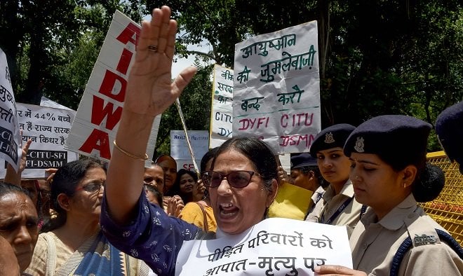an indian women activist shout slogans during a protest against the deaths of more than 100 children in muzaffarpur photo afp