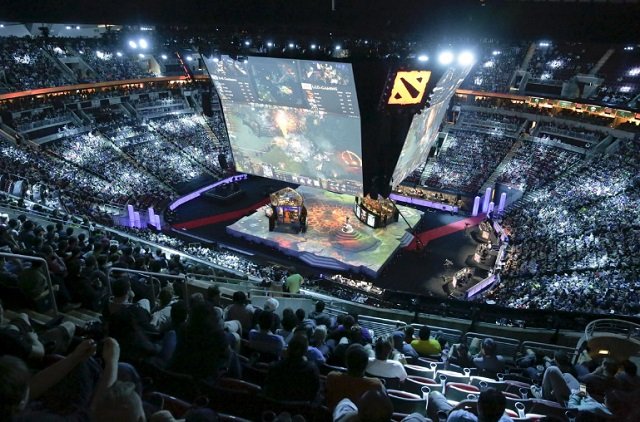 fans watch a multi player video game competition during the international dota 2 championships at key arena in seattle washington us august 8 2015 photo reuters