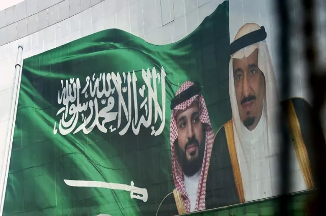 saudi king salman and his son crown prince mohammed appear next to a saudi flag on a billboard in riyadh photo afp saudi king salman and his son crown prince mohammed appear next to a saudi flag on a billboard in riyadh photo afp