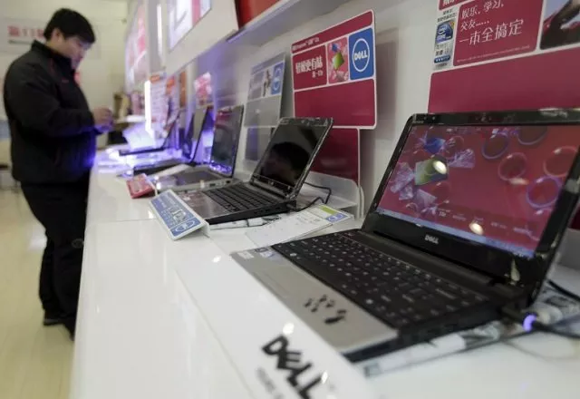 a customer looks at laptops at a dell outlet in beijing december 13 2010 photo reuters a customer looks at laptops at a dell outlet in beijing december 13 2010 photo reuters