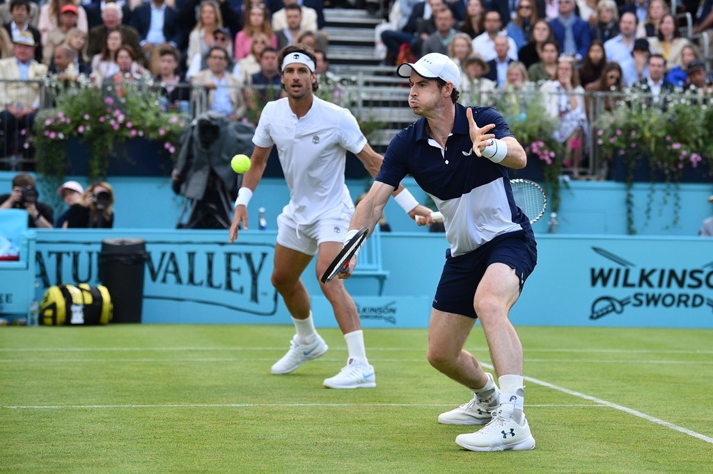 partnering up murray partnered spain 039 s feliciano lopez to a 7 6 7 5 6 3 victory in his first competitive match in five months photo afp