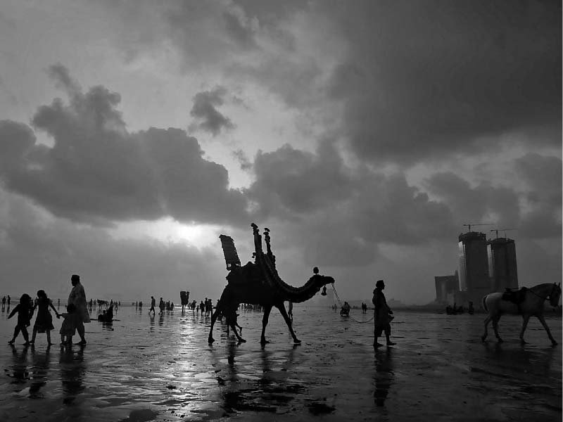 karachiites enjoy a pleasant sunset at sea view beach as the city finally gets a respite from the heat on friday photo inp