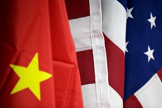 flags of us and china are displayed at american international chamber of commerce aicc 039 s booth during china international fair for trade in services in beijing china may 28 2019 photo reuters