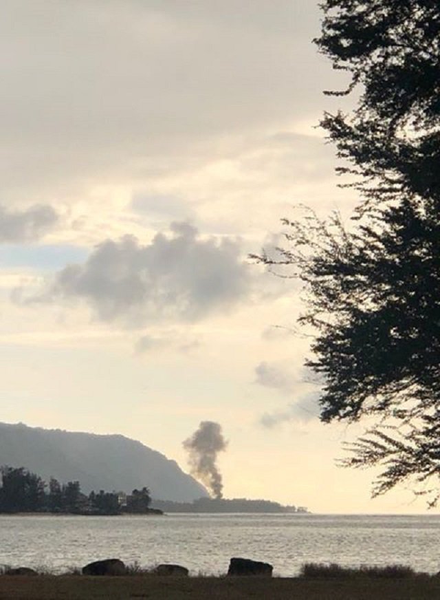 a plume of smoke rises after an airplane crash seen from kaiaka bay beach park in haleiwa hawaii us photo reuters