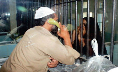 after ban on meetings jail hooks up telephones across a glass wall