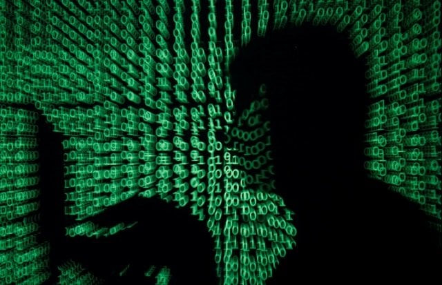 a man holds a laptop computer as cyber code is projected on him in this illustration picture taken on may 13 2017 photo reuters a man holds a laptop computer as cyber code is projected on him in this illustration picture taken on may 13 2017 photo reuters