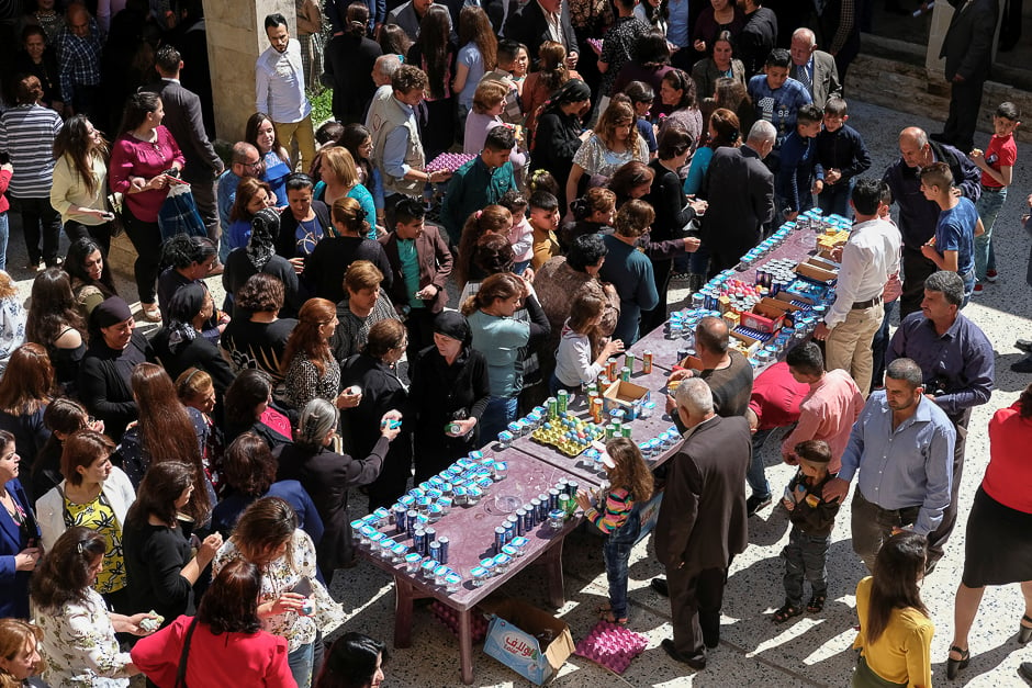 Believers take part celebrations after the Easter Mass in Mar Gewargis (St George) Chaldean Catholic church, which was damaged by Islamic State militants, in the town of Tel Esqof, Iraq. PHOTO: REUTERS