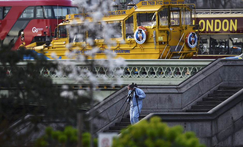 A forensics investigator works at the scene after the attack. PHOTO: REUTERS