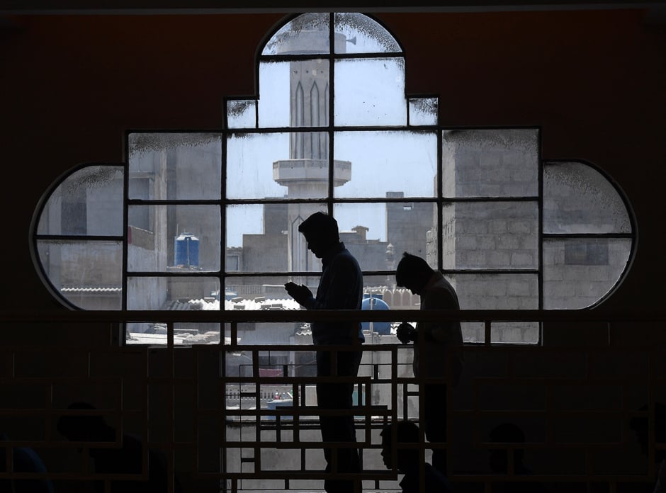 Pakistani Christians attend a Good Friday service at Saint Peter's Catholic Church in Karachi. PHOTO: REUTERS