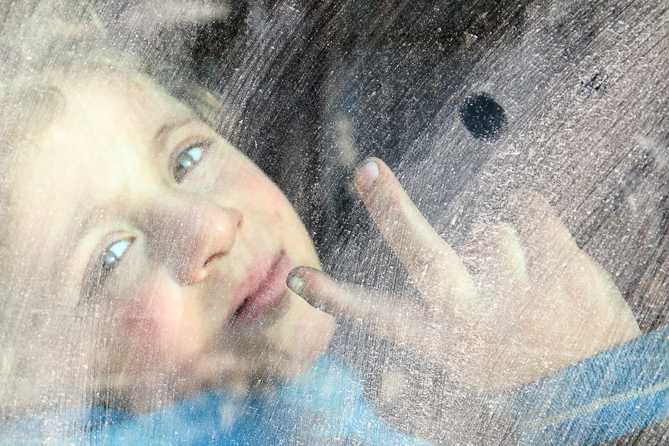A boy flashes the victory sign while riding a bus to be evacuated from a rebel-held sector of eastern Aleppo, Syria. PHOTO: REUTERS