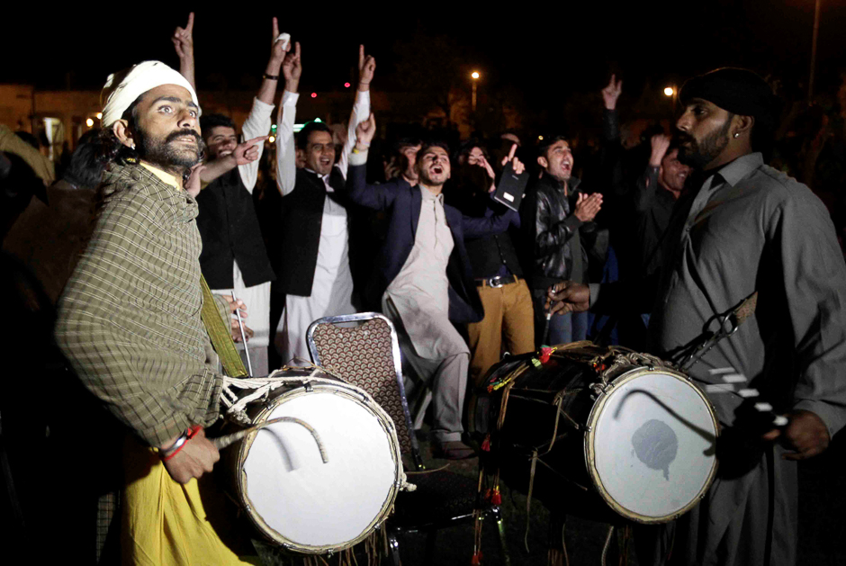 Cricket fans cheer as they watch the hugely anticipated final of its domestic cricket league, Pakistan Super League (PSL) on a large screen TV in Islamabad. PHOTO: REUTERS