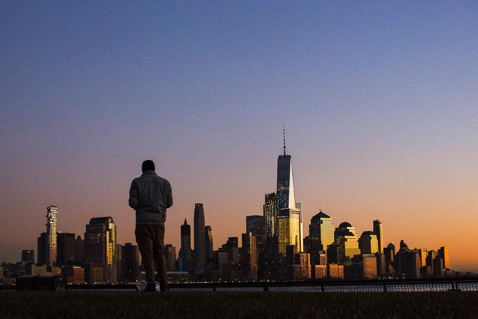 The setting sun casts light on lower Manhattan and One World Trade Centre in New York City on December as seen from Hoboken, New Jersey. PHOTO: AFP