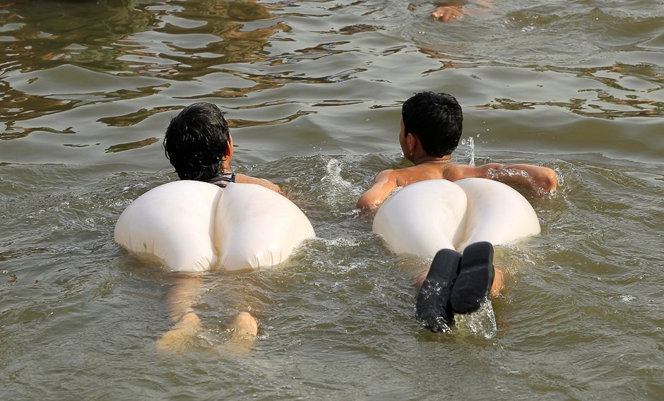 boys swim in a stream during a heatwave in islamabad pakistan photo reuters