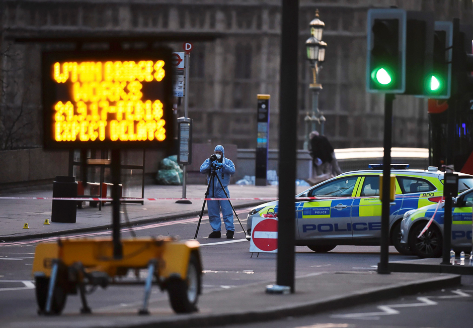 A forensics investigator works at the scene. PHOTO: REUTERS