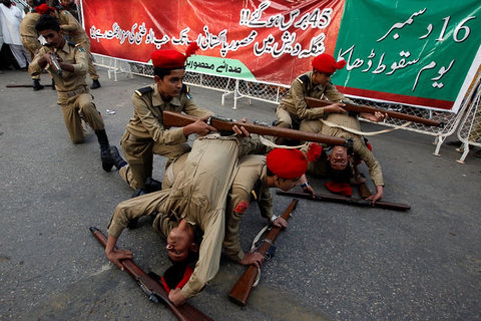 School children in uniform perform, in commemoration of the victims of an attack on the Army Public School in 2014, during a demonstration in Karachi, Pakistan. PHOTO: REUTERS